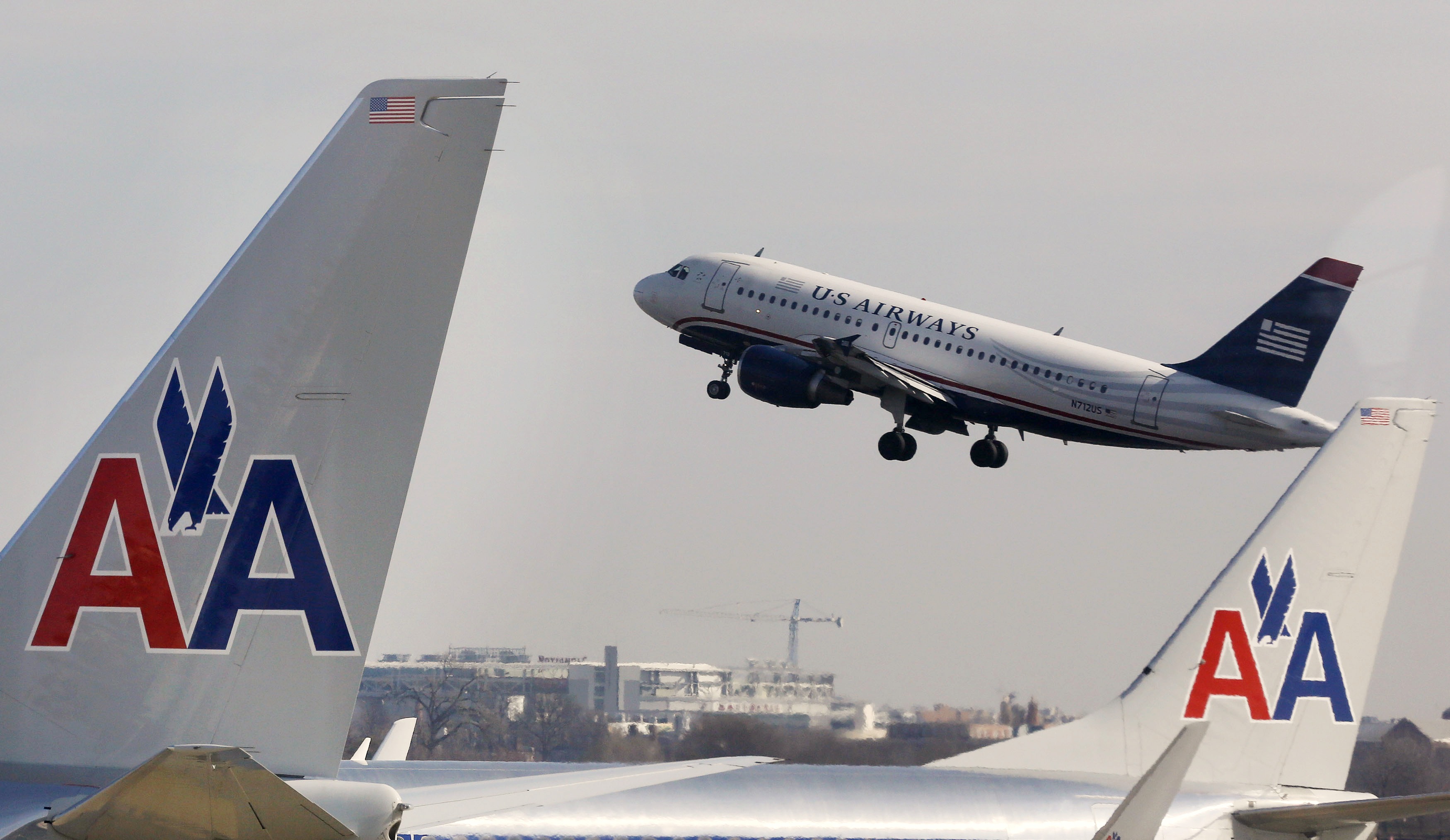 The US Justice Department says a planned American Airlines merger with US Airways would create too much consolidation and lead to higher fares for consumers. Photo: Reuters