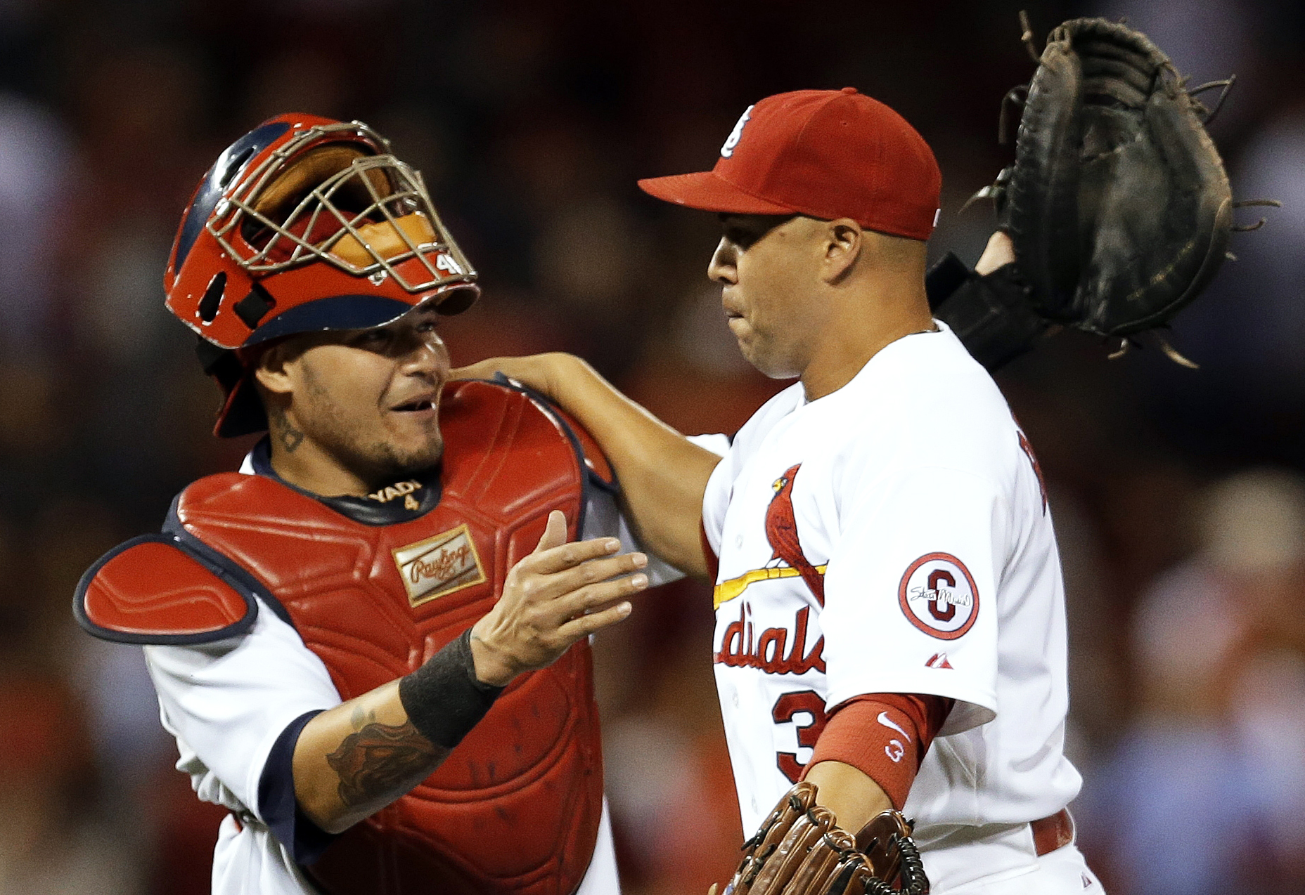 St. Louis Cardinals' Yadier Molina, left, and Carlos Beltran celebrate following the Cardinals' 4-3 victory over the Washington Nationals. Photo: AP