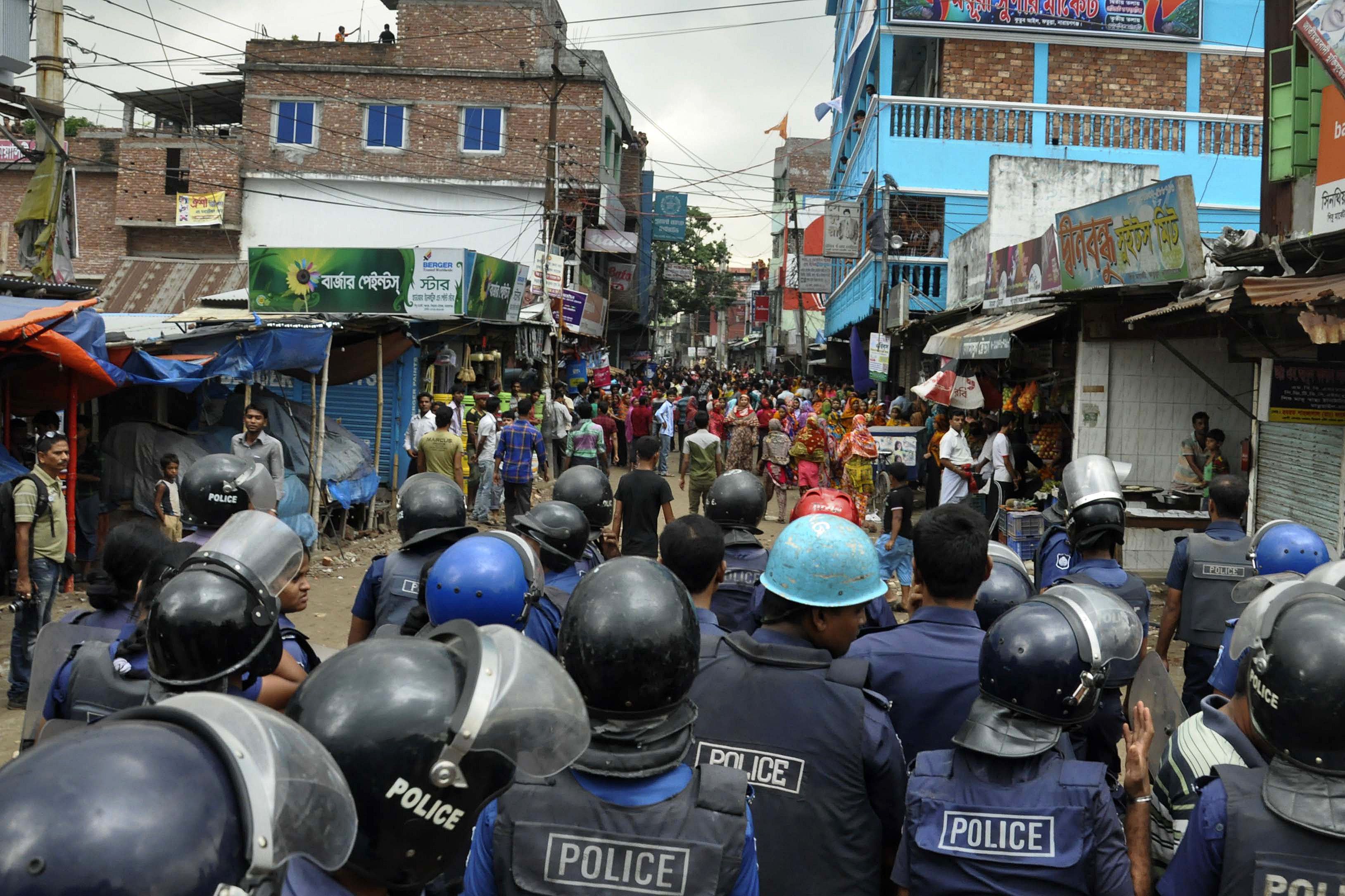 Bangladeshi police confront protesting garments workers on Wednesday. Photo: AFP