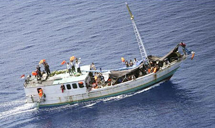  A boat carrying suspected illegal immigrants photographed from a Australian Border Protection Command aircraft. Photo: Reuters