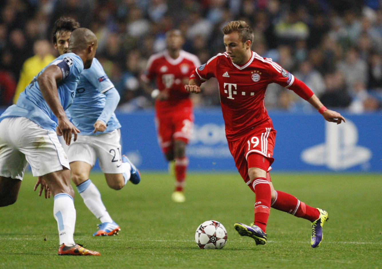 Bayern's Mario Goetze, right, and Manchester City's Vincent Kompany challenge for the ball. Photo: AP