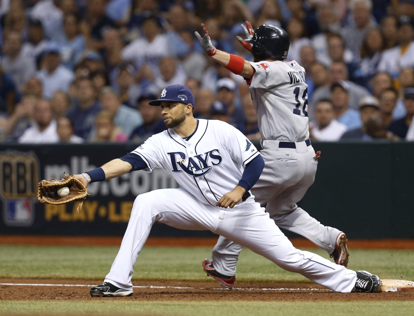 Red Sox's Shane Victorino on first base as Rays first baseman James Loney catches the throw. Photo: AP