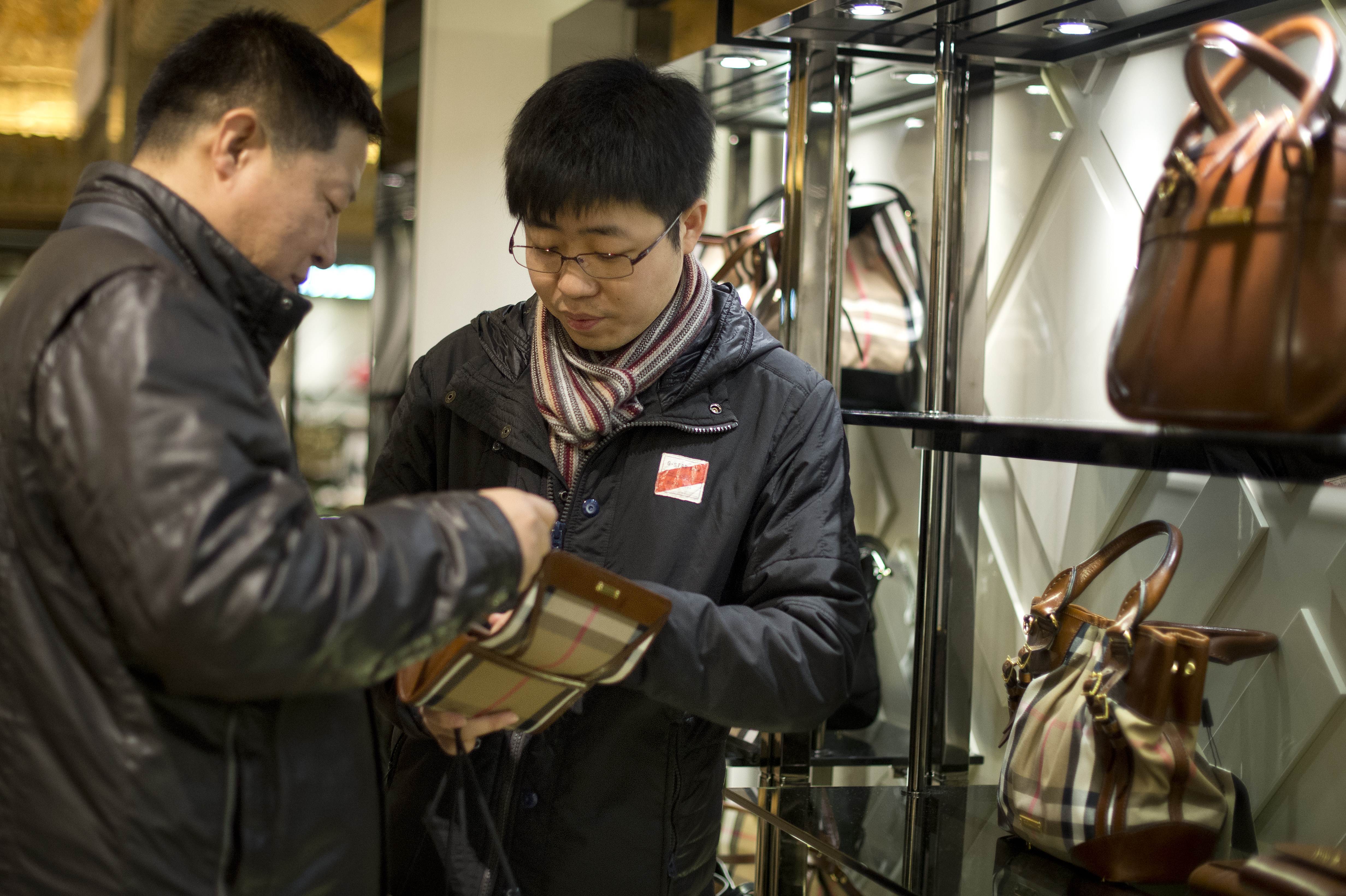 Chinese tourists shop at Harrods department store in London. Photo: AFP