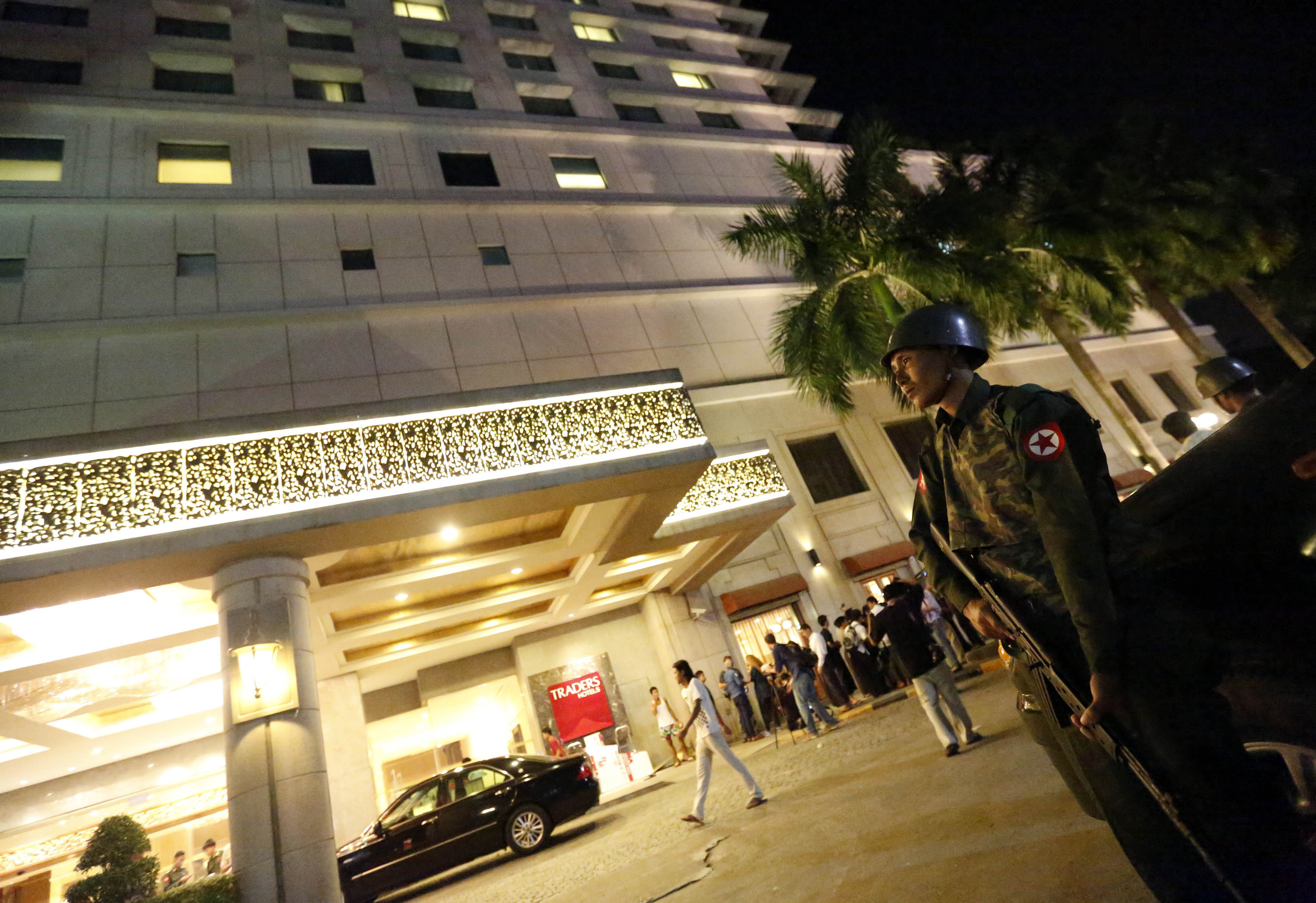 A soldier in front of the Traders Hotel after an explosion in central Yangon, Myanmar. Photo: Xinhua