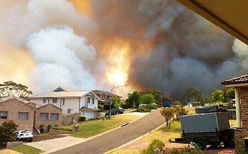 Australian firefighters are battling major wildfires in New South Wales, with fears hundreds of homes have been destroyed. Photo: EPA