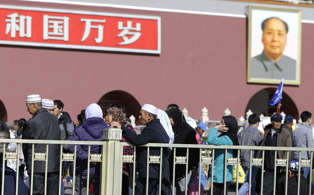 Tourists in front of the gate in Tiananmen Square yesterday,
the scene of Monday’s deadly jeep crash. Photo: Reuters