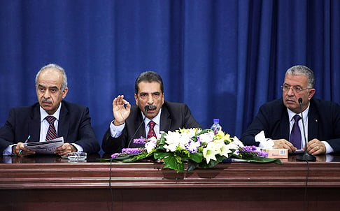 Tawfiq Tirawi (centre), Palestinian inquiry chief into the death of late Palestinian leader Yasser Arafat, speaks at a press conference in Ramallah. Photo: AFP