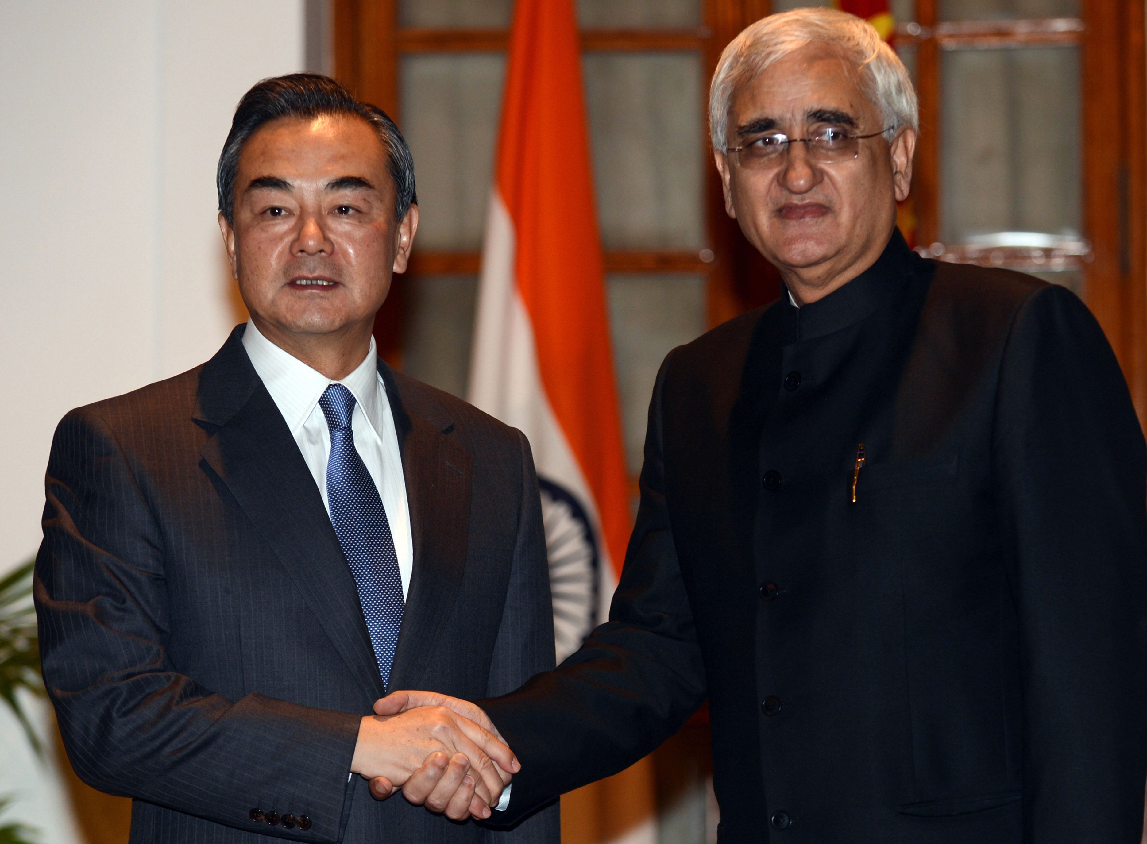 Chinese Foreign Minister Wang Yi with Indian Minister for External Affairs Salman Khurshid. Photo: AFP