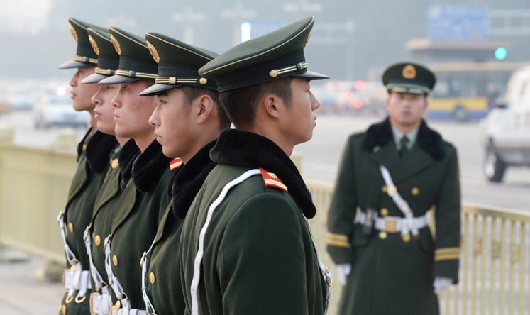 Chinese para-military police stand guard in Tiananmen Square on November 8, 2013. Photo: AFP