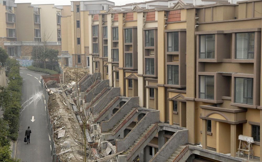 China began levying a property tax in Shanghai and Chongqing in 2011. Photo: Reuters