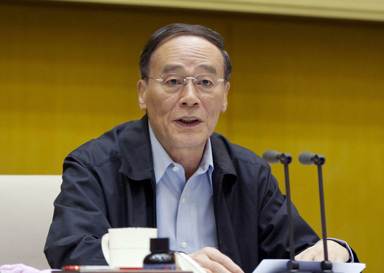 Wang Qishan, head of the Communist Party's anti-corruption body, speaks at a meeting in Beijing in May 2013. Photo: Xinhua