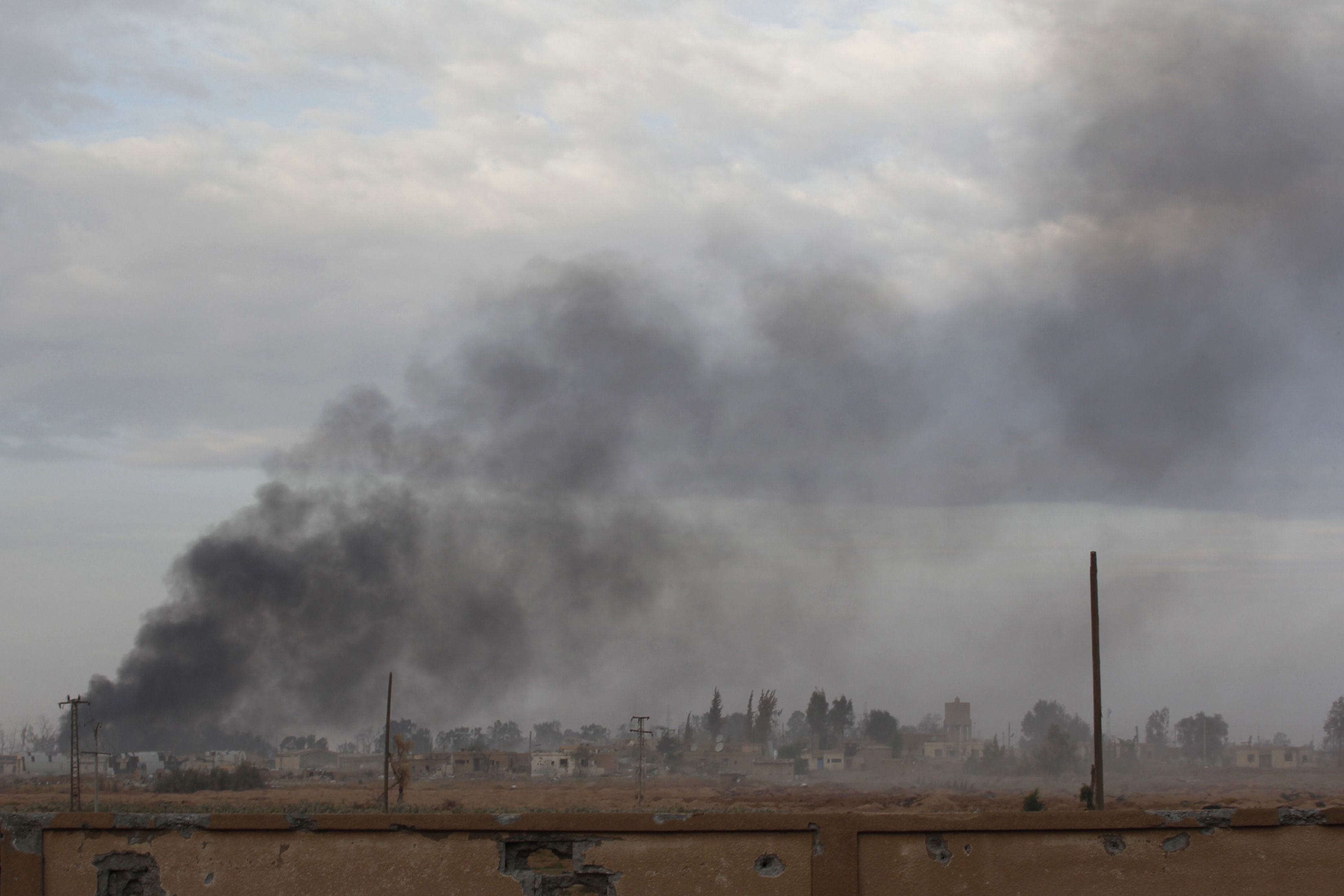 Smoke rises due to clashes between Free Syrian Army fighters and forces loyal to President Bashar al-Assad. Photo: Reuters