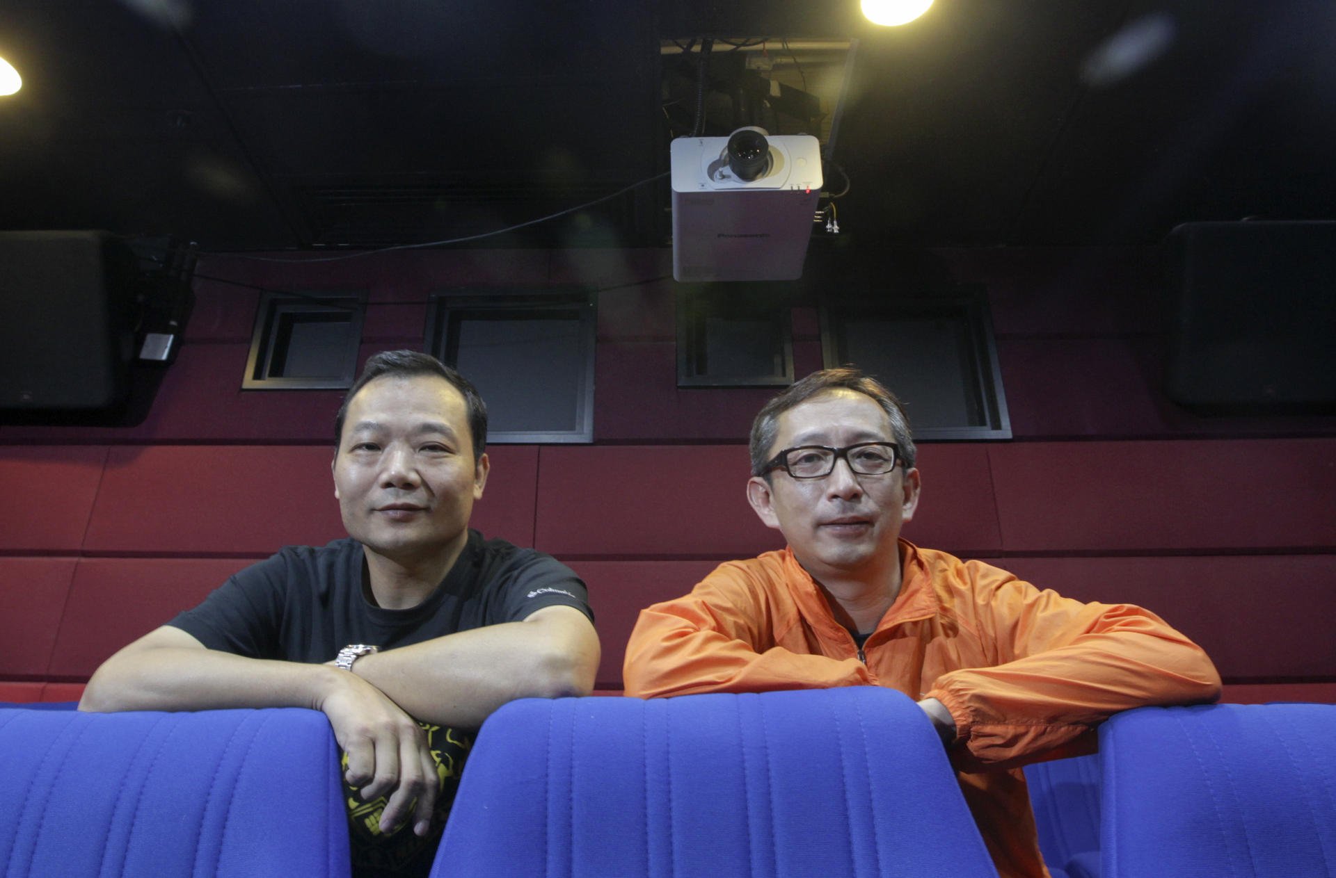 Cinema managers Kwok Yee-kwan (left) and Lee Chi-wai have fond memories of the days of celluloid film projection. Photo: David Wong