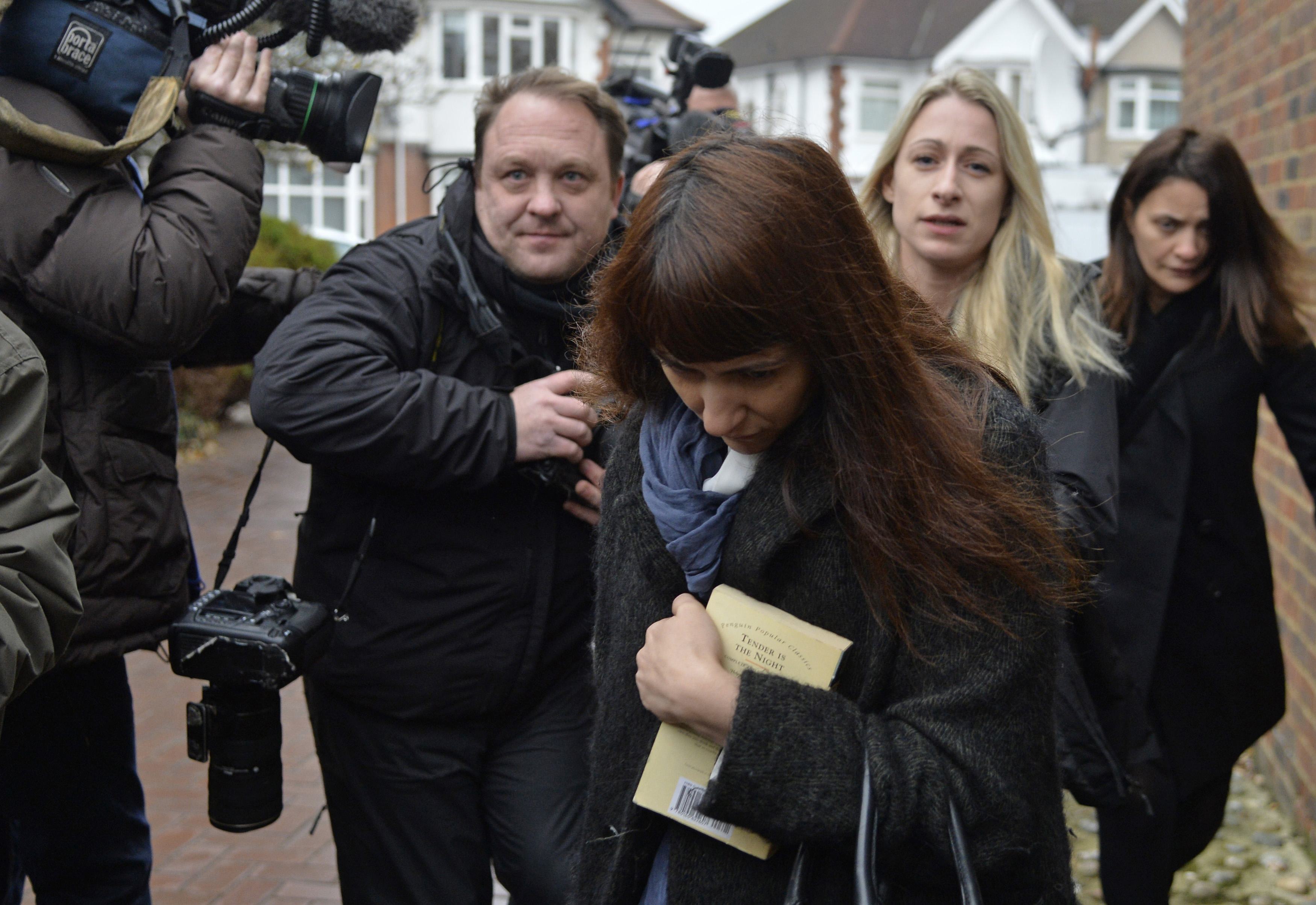 Italian sisters Elisabetta (right) and Francesca (centre) Grillo are surrounded by members of the media as they arrive at Isleworth Crown Court in west London. Photo: Reuters