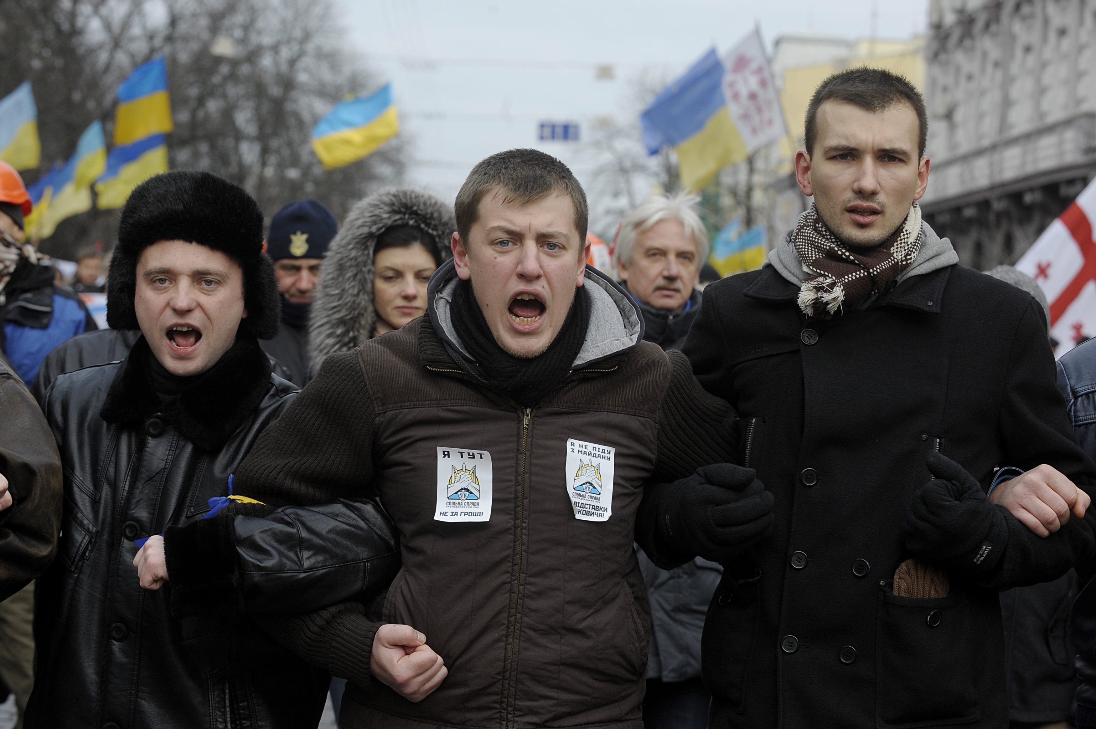 Protesters shout slogans as they march through Kiev. Photo: EPA