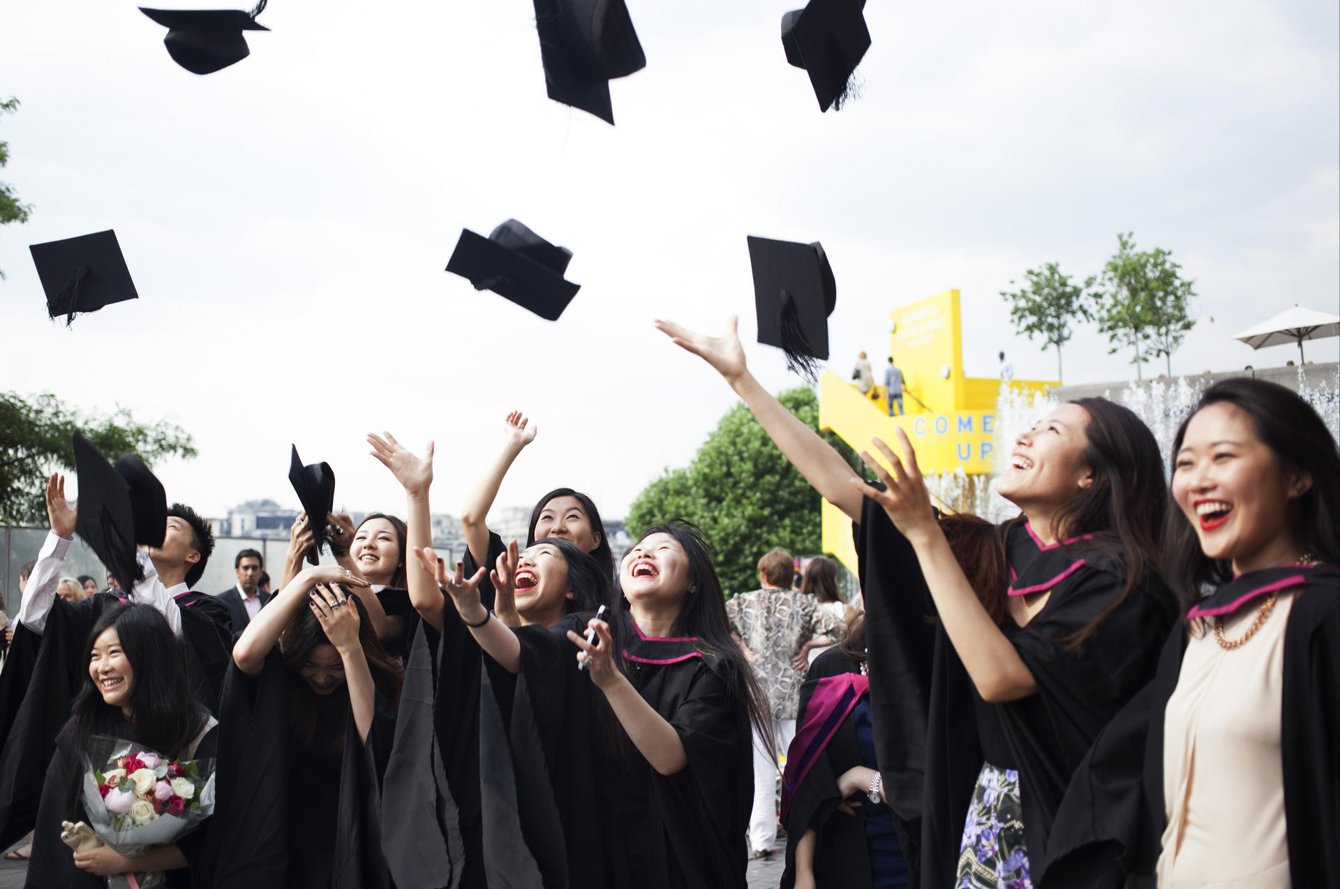 Students from the University of the Arts London celebrate after their graduation ceremony.
