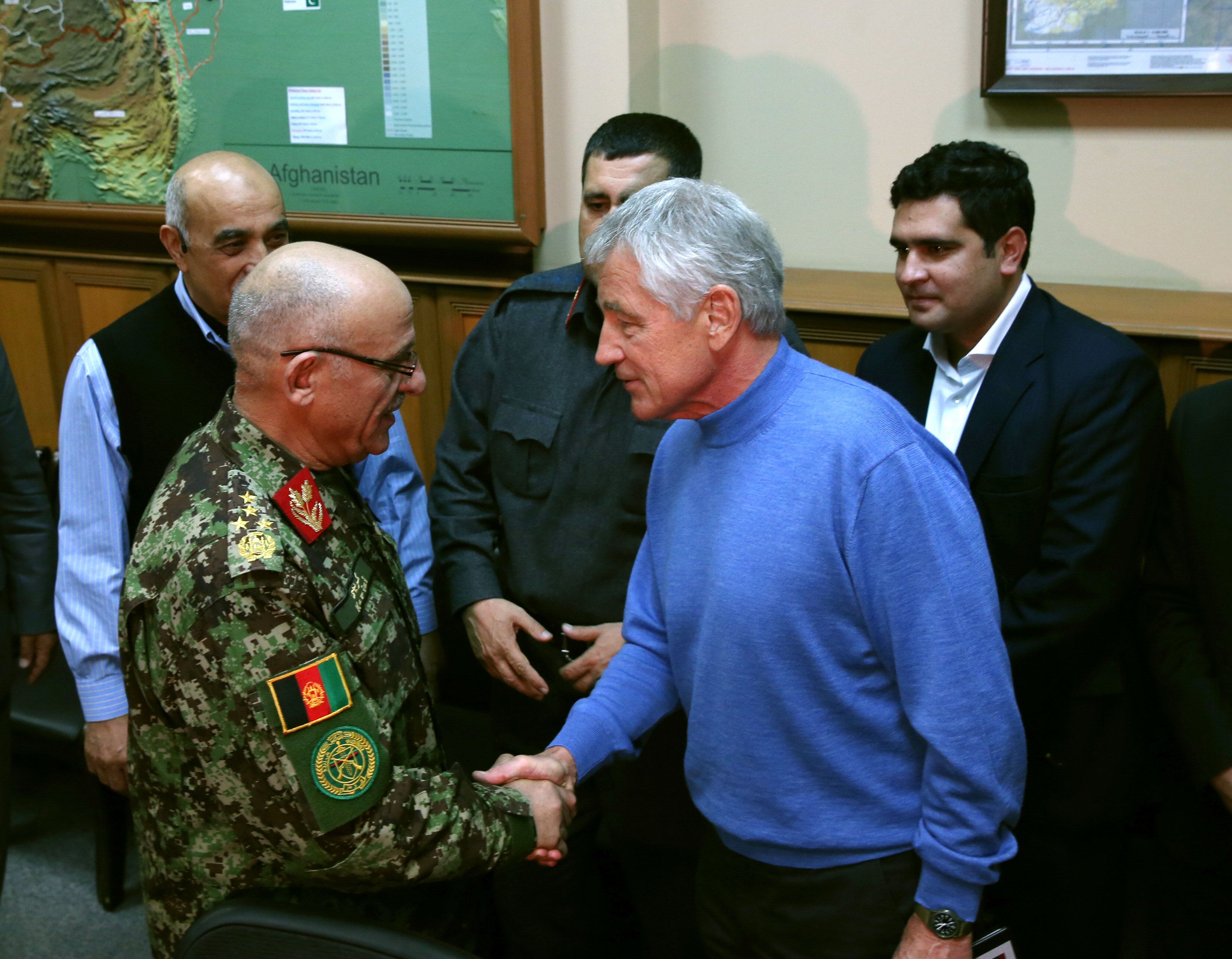 US Secretary of Defence Chuck Hagel and Afghan General Sher Mohammad Karimi. Photo: AFP