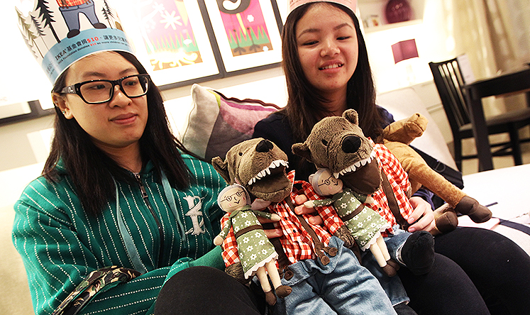 Customers Tomato Chin and Eunice Tong with their Lufsig wolf doll in furniture store Ikea in Causeway Bay. Photo: David Wong