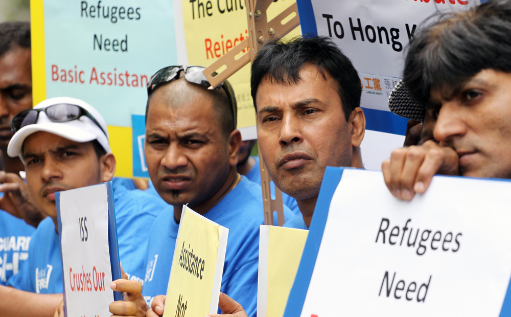 A group of refugees protest outside Legislative Council in Tamar which is against the city's poor treatment to refugees. Photo: Felix Wong