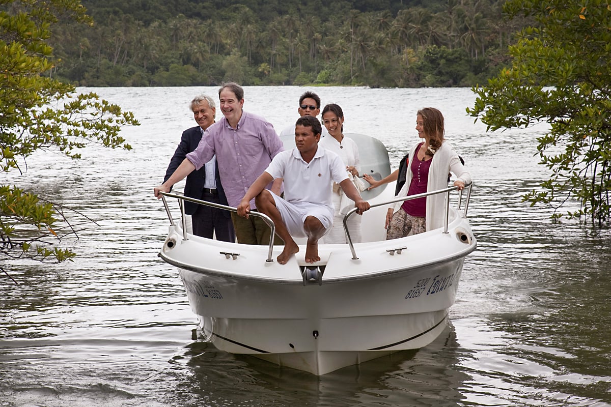 Slow Life Symposium chairman Jonathon Porritt (second from left) arrives by boat at the Soneva Kiri resort, on the Thai island of Koh Kood, ahead of last month's conference. Photos: courtesy of Slow Life Symposium; AFP
