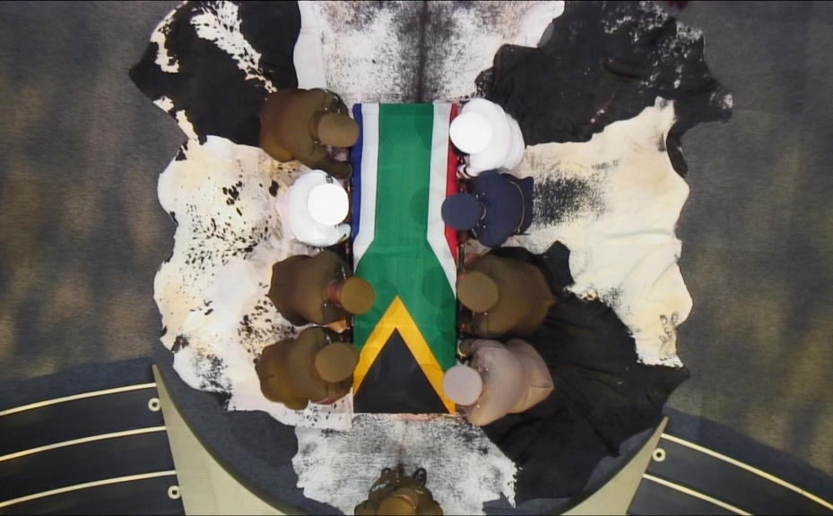 Nelson Mandela's coffin is carried by military personnel at the end of his funeral service in his ancestral village of Qunu. Photo: Reuters