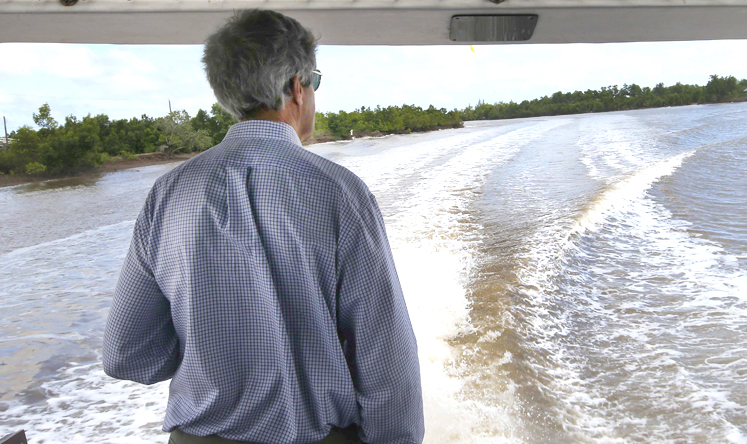 US Secretary of State John Kerry rides a boat through the Mekong River Delta. Photo: Reuters
