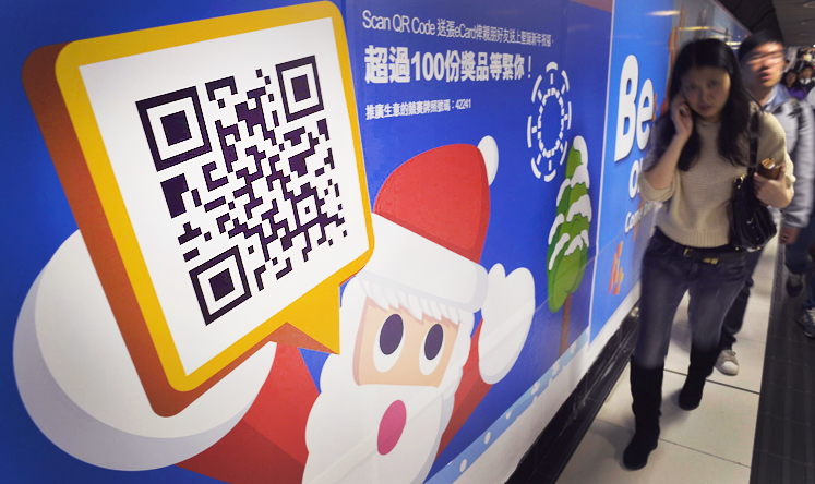 The crossover of various advertising media is slowly taking shape in Hong Kong with the growing use of QR code. Photo: Warton Li
