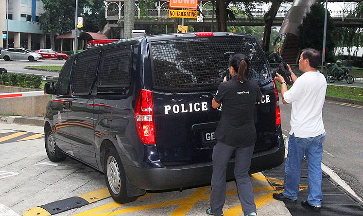A police van transporting arrested foreign labourers arrives at the Subordinate courts in Singapore on Tuesday. Photo: AFP