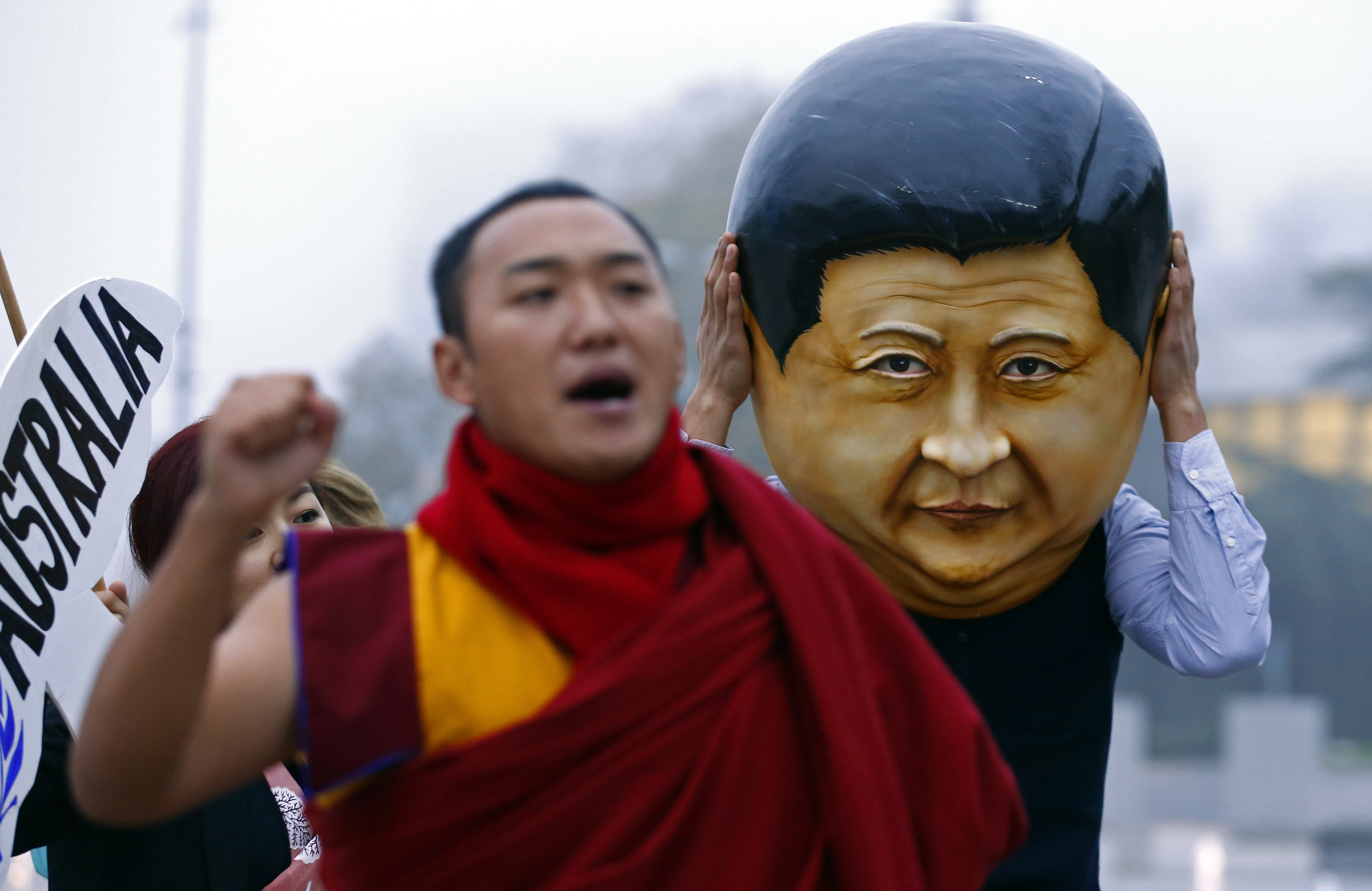 A protester wearing a giant head representing President Xi Jinping takes part in a demonstration at the UN in Geneva in October. Photo: Reuters