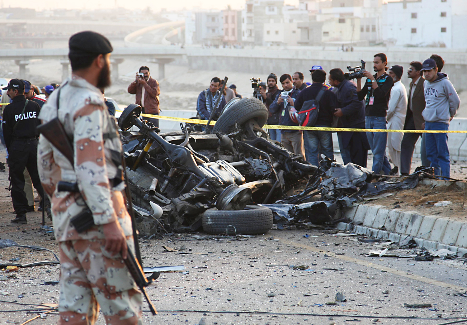 Pakistani security officials at the site of a bomb blast that killed senior police official Chaudhry Aslam on Thursday. Photo: EPA