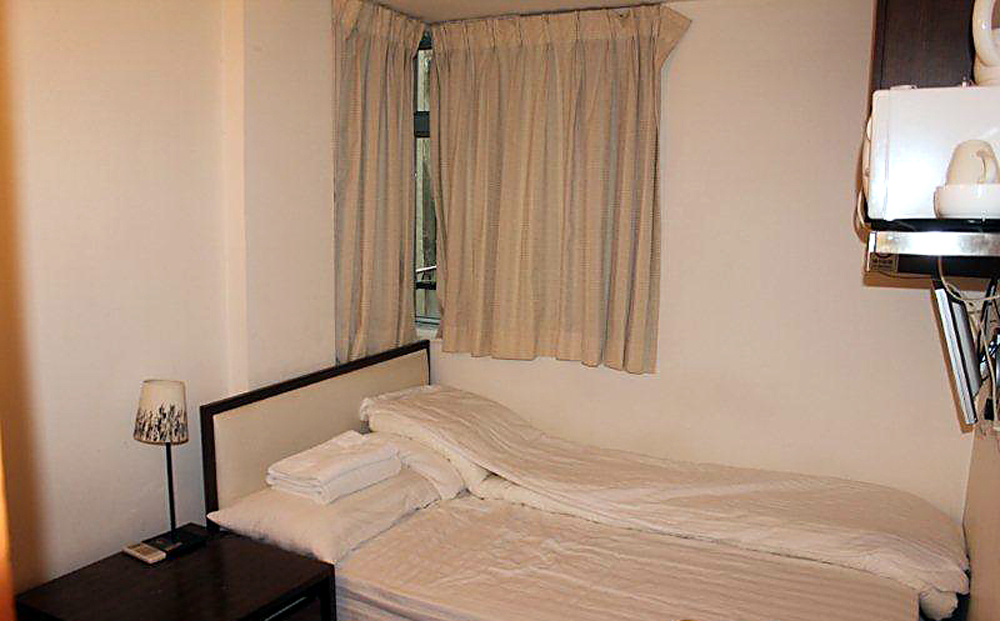 A picture provided by 9 Studios for a room for two available for online booking in Sharp Street East, Causeway Bay, near Times Square. According to the government online database, there is no licensed guest house on that street. Photo: SCMP 