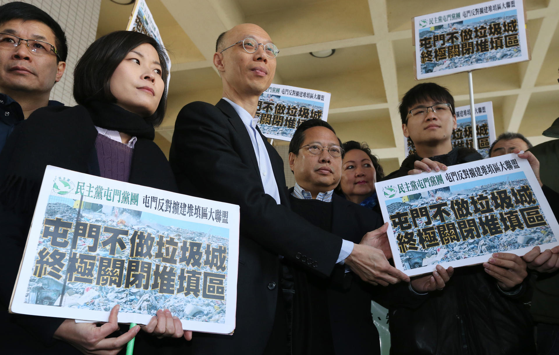 Secretary for the Environment Wong Kam-sing (third from left) receives petitions from lawmaker Albert Ho Chun-yan (to his left) and protesters. Photo: David Wong