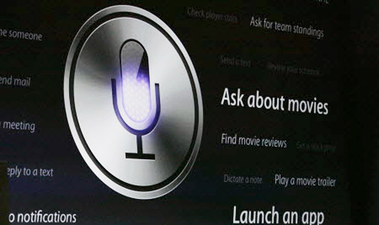 The Siri logo is shown on the big screen during an Apple software presentation. Photo: Gary Reyes/MCT