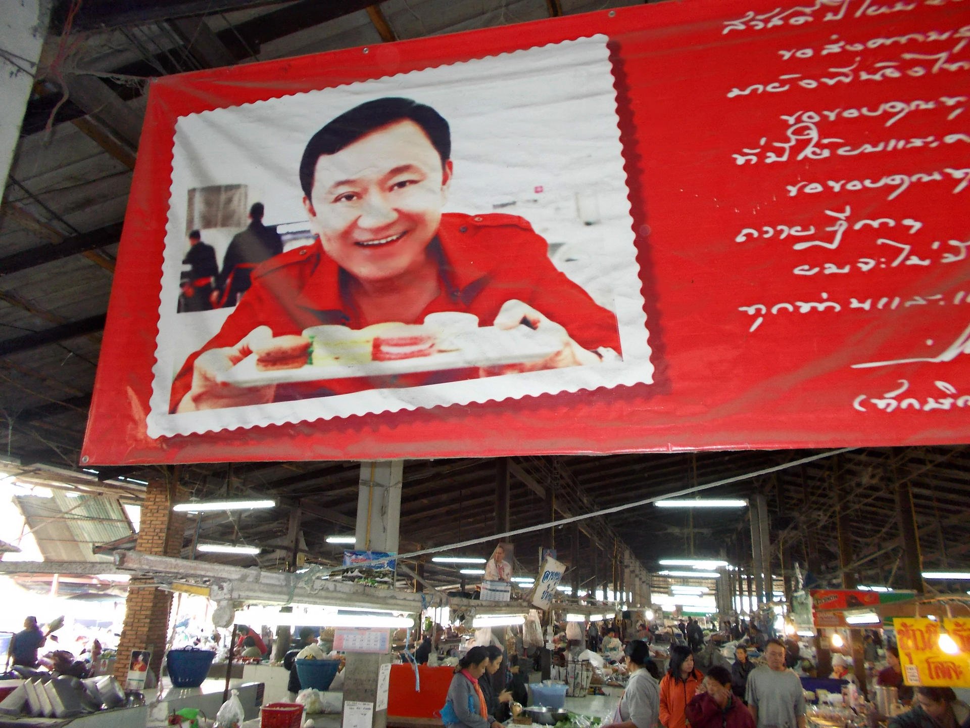 A market in Thaksin Shinawatra's hometown of San Kamphaeng, near Chiang Mai, displays a photograph of him. Photo: Tom Fawthrop