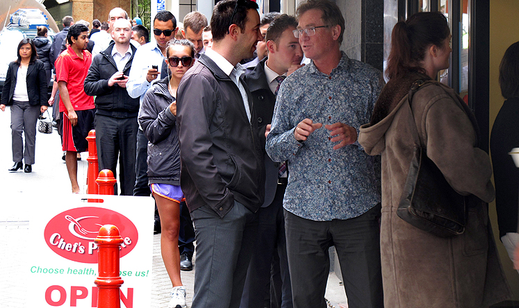 Workers queue at the Chef's Palette restaurant in Wellington on Tuesday. Photo: AP