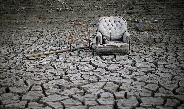 Discarded chairs sit on the dried and cracked bed of the Almaden Reservoir in San Jose, California. Photo: AFP