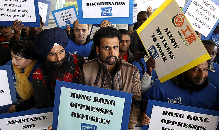 Asylum seekers demonstrate outside the Legislative Council. Photo: Dickson Lee
