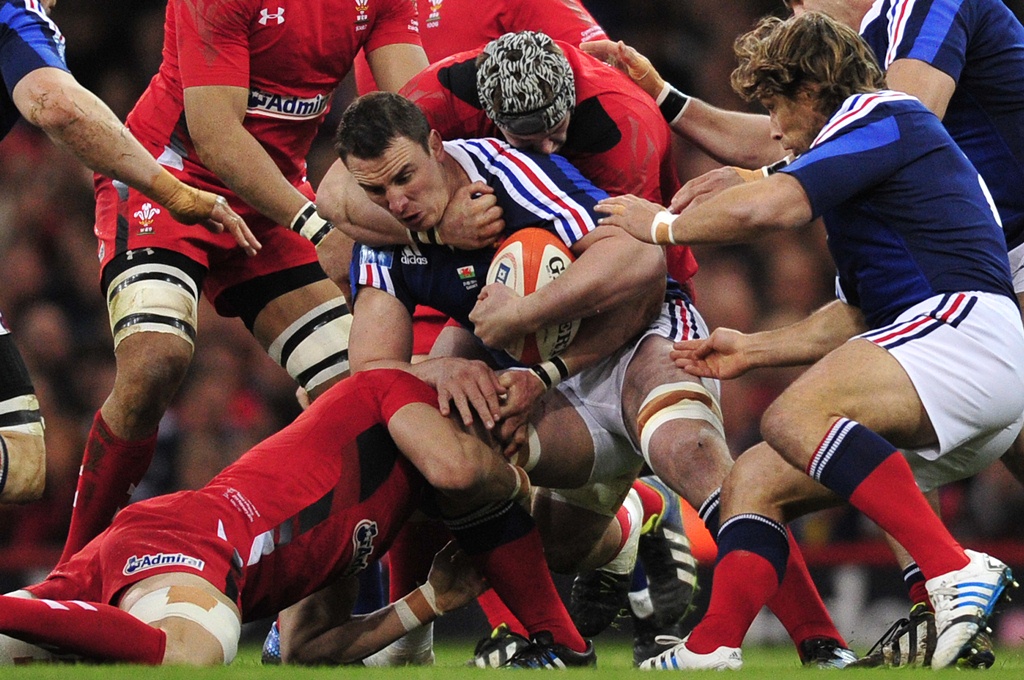 France number eight Louis Picamoles is swamped by the Wales defence during their Six Nations match in Cardiff on Friday. Photo: AFP