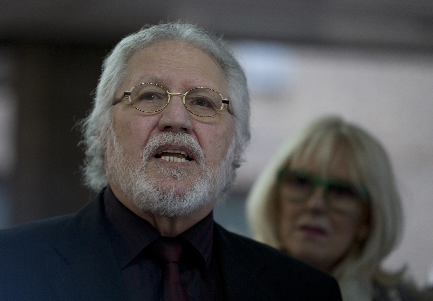 Dave Lee Travis speaks to the media as he leaves court after hearing that he will face a retrial over allegations he sexually assaulted two women. Photo: AP