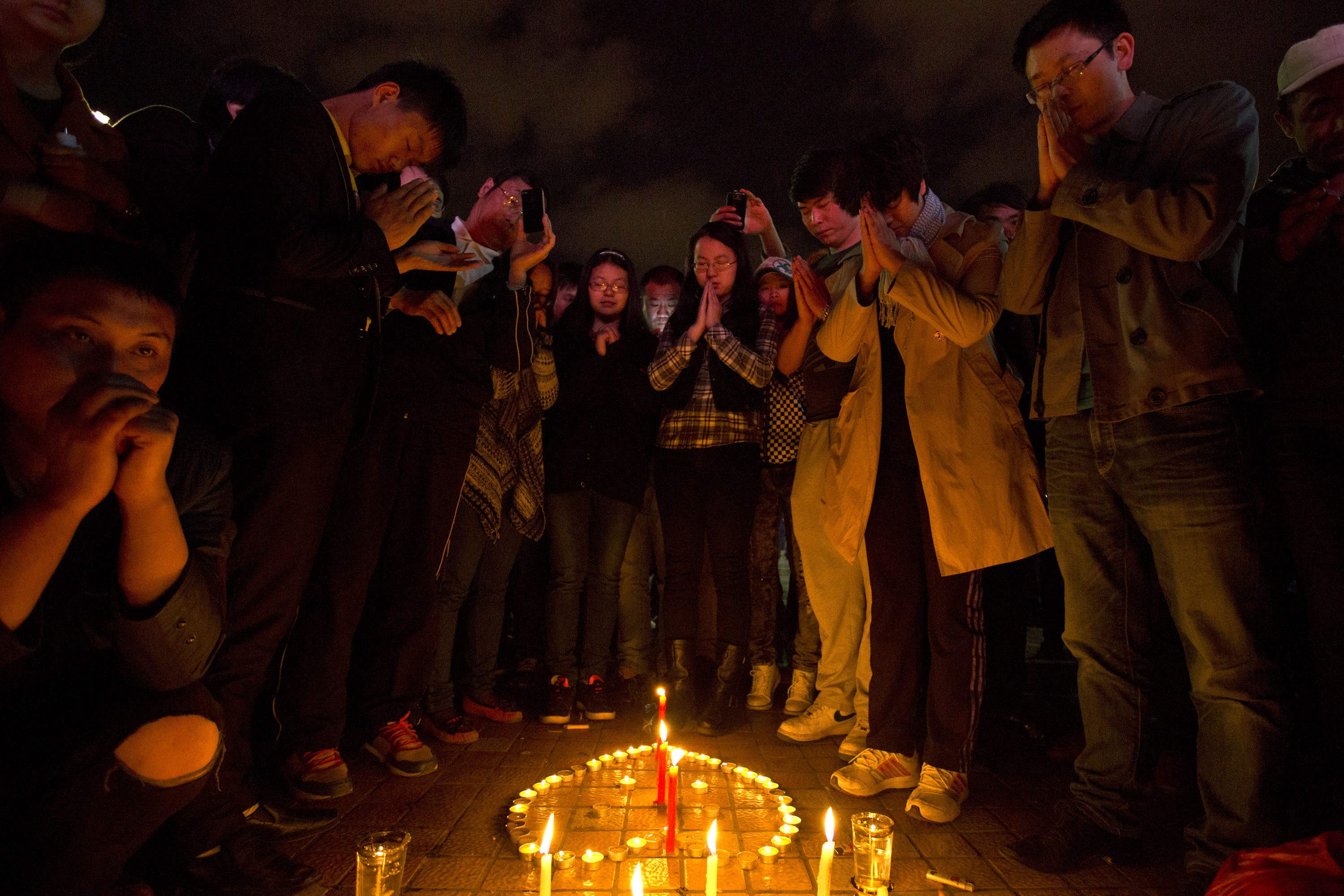 A candlelit vigil is held at Kunming, following the massacre of 29 civilians. Photo: AP