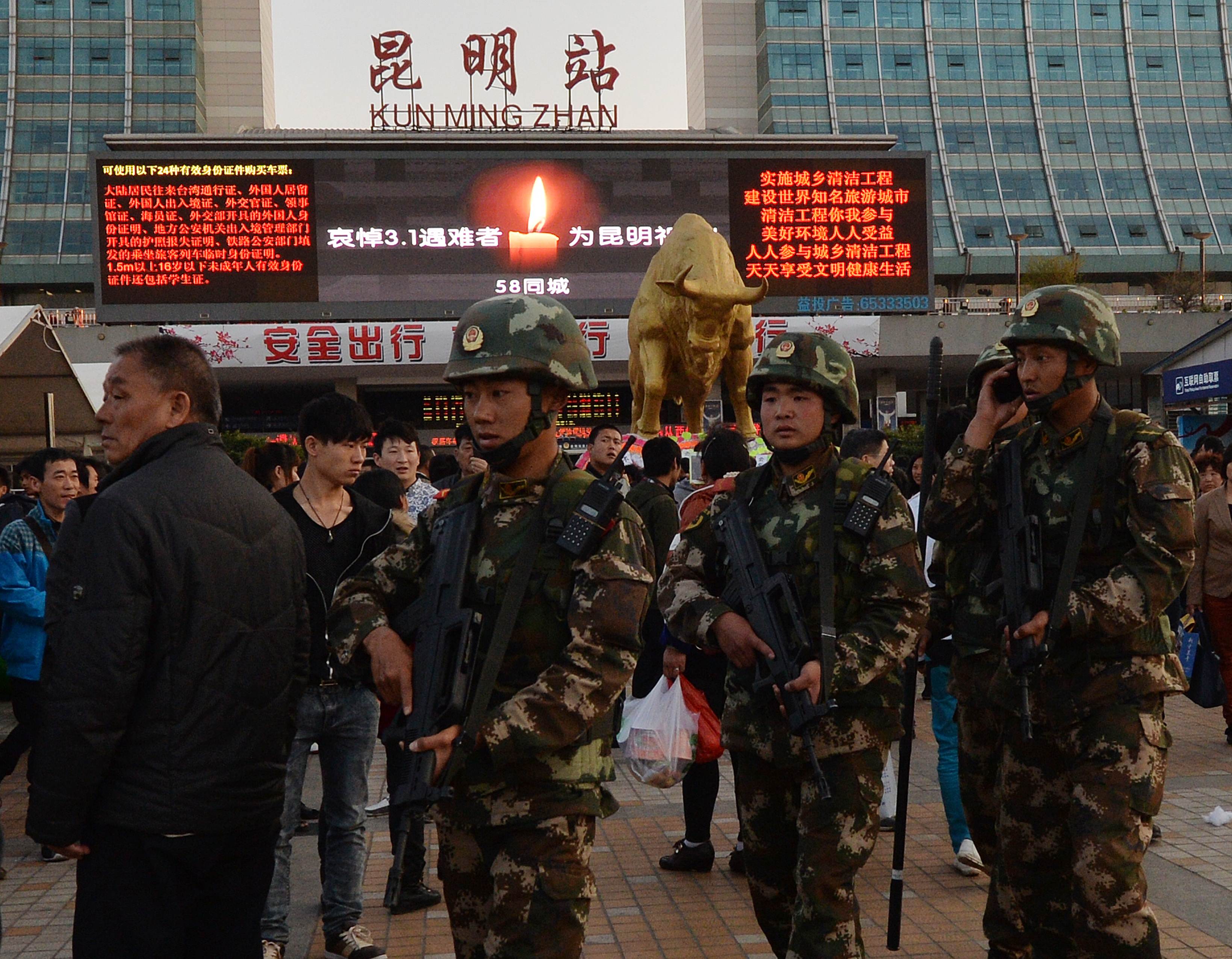 Chinese paramilitary police patrol outside the scene of the attack at the main train station in Kunming, Yunnan Province, on March 3, 2014. Photo: AFP