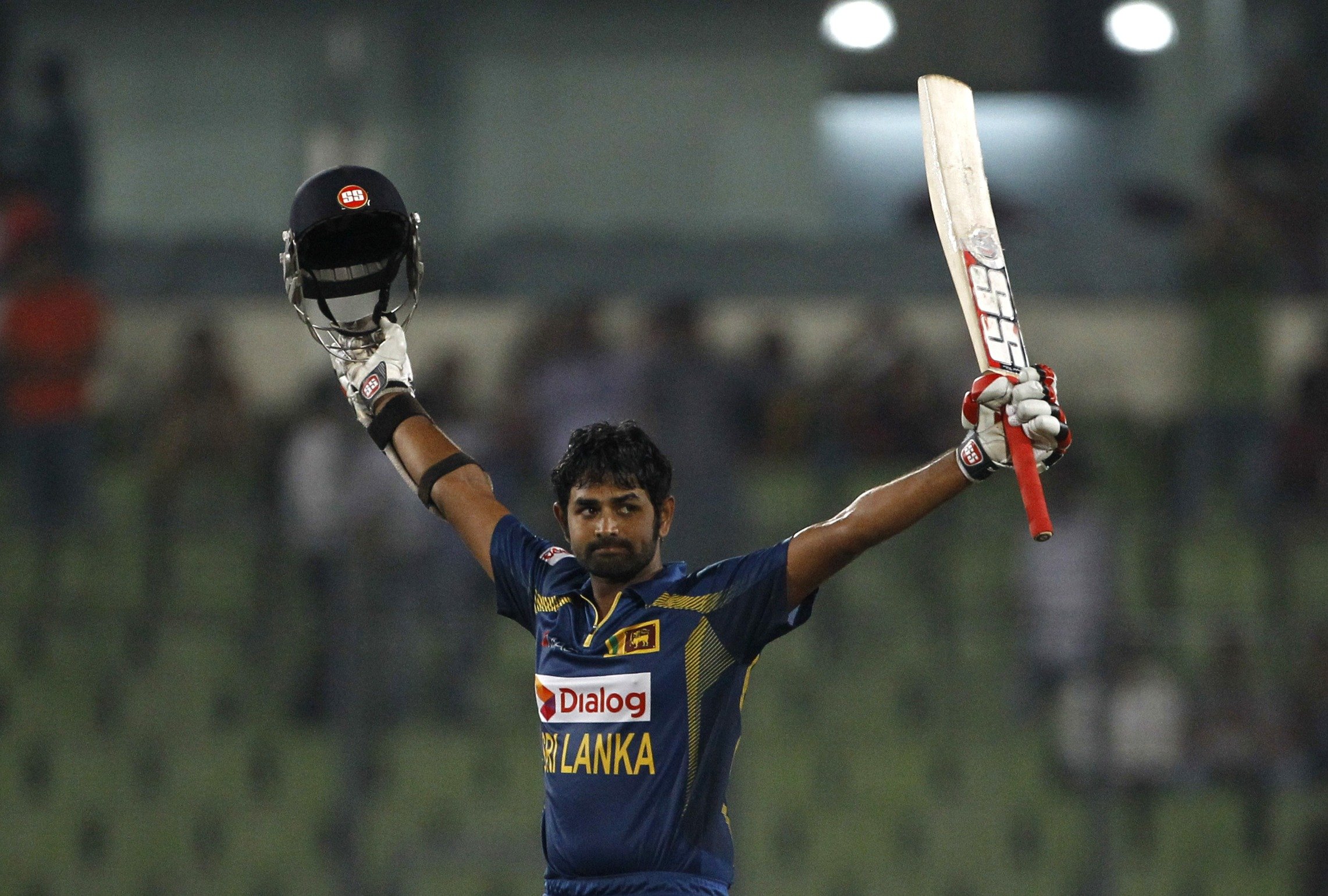 Sri Lanka's Lahiru Thirimanne celebrates after scoring a century during the Asia Cup final cricket match against Pakistan in Dhaka. Photo: AP 