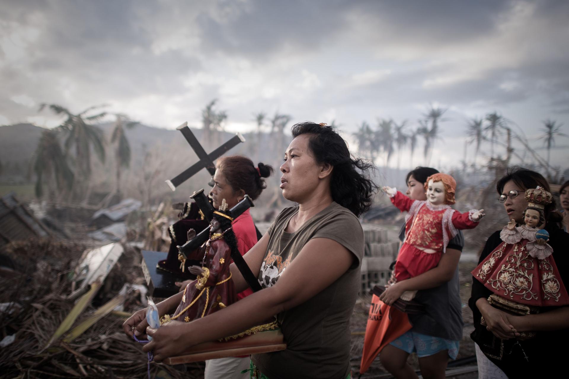 Opong's typhoon survivors hold a religious procession 10 days after the storm struck in this award-winning photo. Photo: AFP
