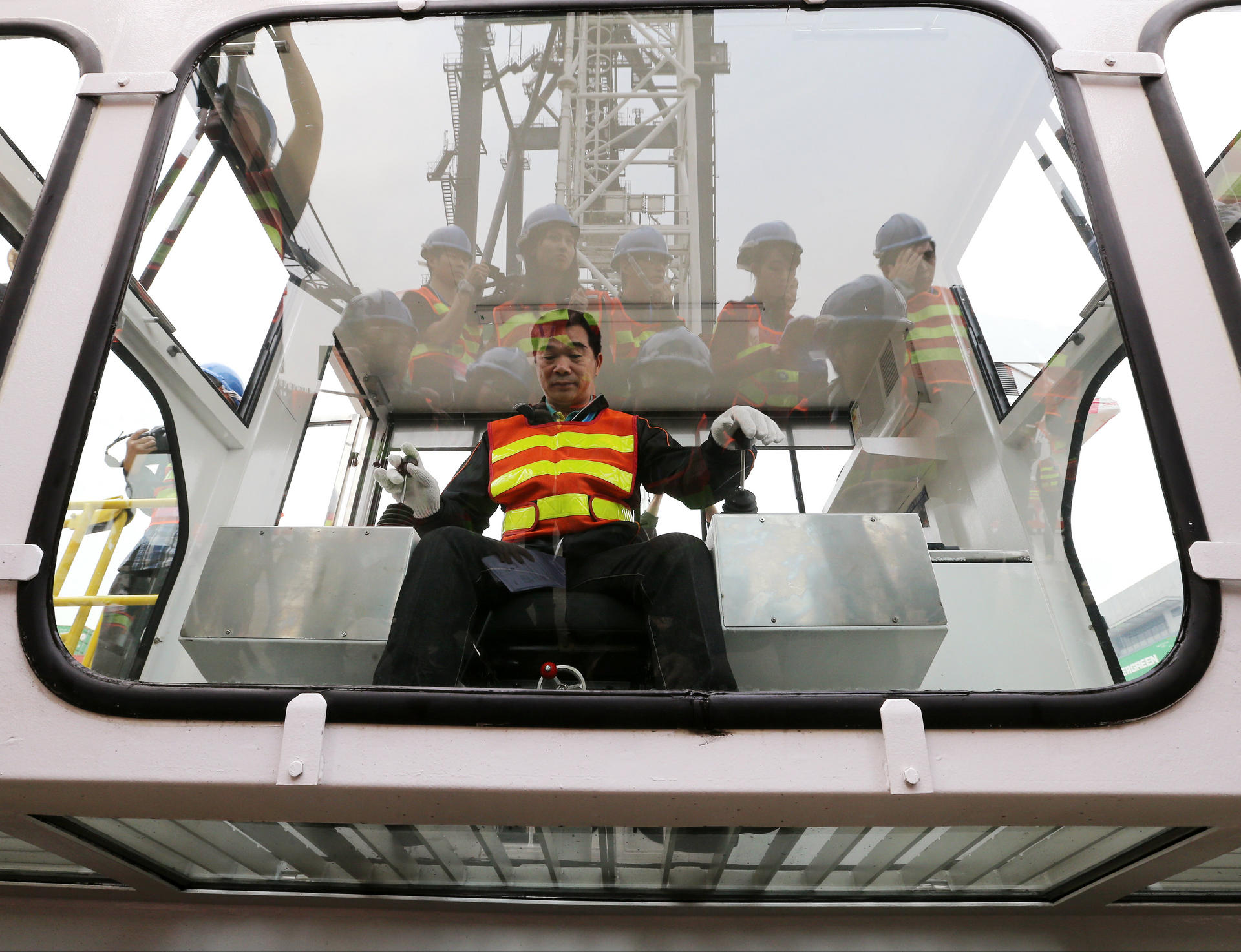 A crane operator shows off an updated operating cabin at Hongkong International Terminals' Kwai Fong port. Photo: K.Y. Cheng