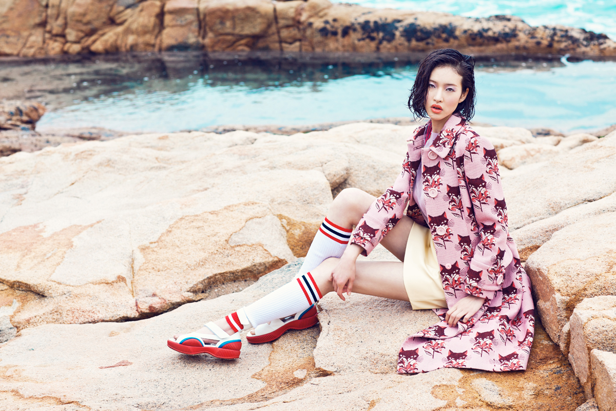 Cat-print coat (HK$27,300), knitted vest (HK$6,250), top (HK$7,000) and skirt (HK$6,500), all by Miu Miu. Sport tube socks (HK$2,450) and sandals (HK$7,600), both by Prada.