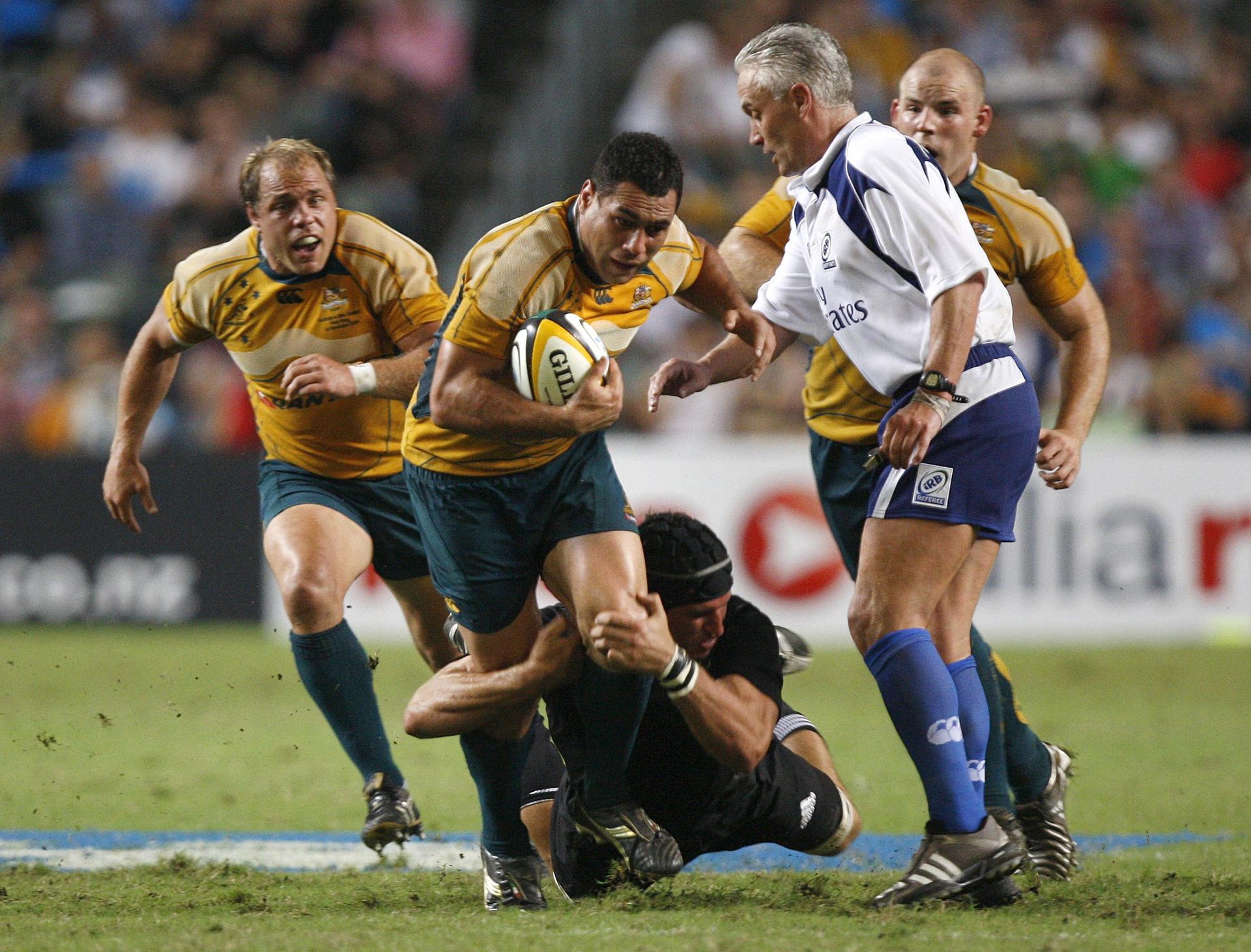 George Smith is tackled by All Black Anthony Boric in their historic Bledisloe Cup match in Hong Kong in 2008. The Wallabies lost 19-14. Photo: Reuters