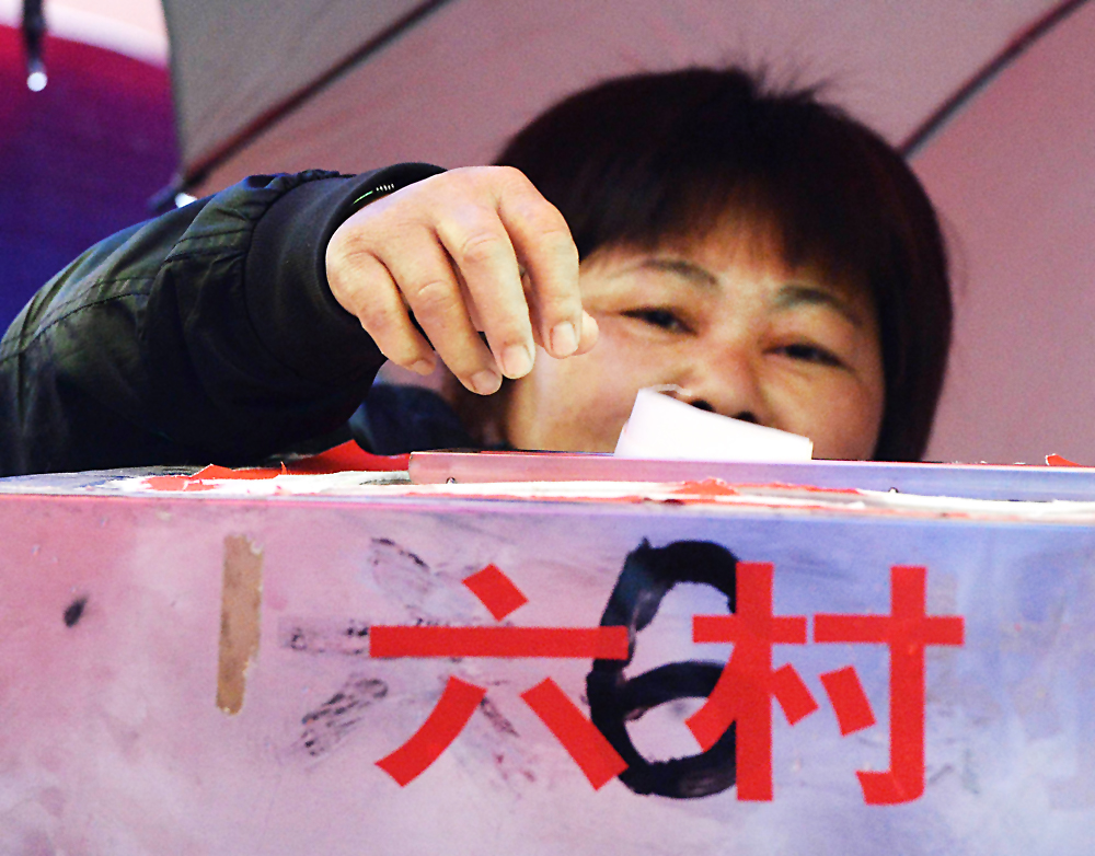 A local resident votes during elections in the village of Wukan. Photo: AFP