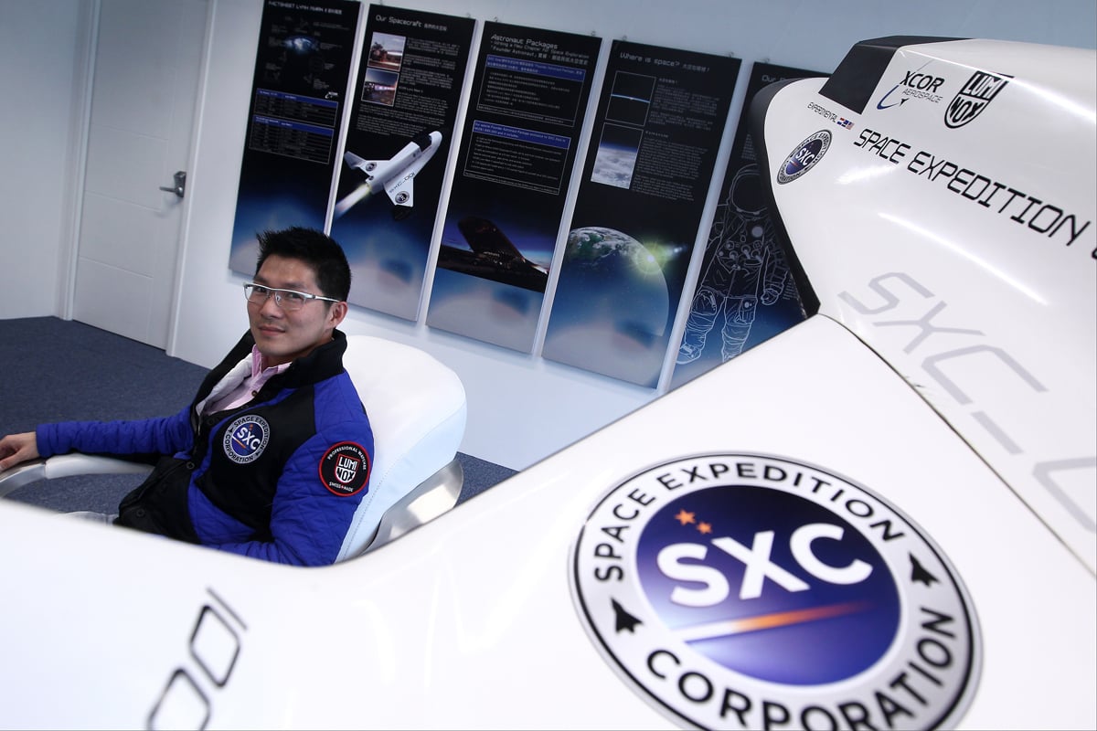 Alex Tang, CEO of Space Expedition Corporation’s Asia- Pacific operations, at his Cyberport office with a mockup of the Lynx spacecraft. Photo: Jonathan Wong