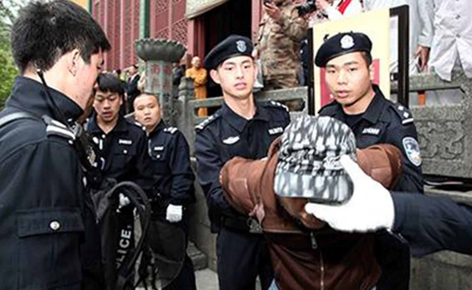 Members of the squad demonstrate how they would restrain a suspect. Photo: SCMP