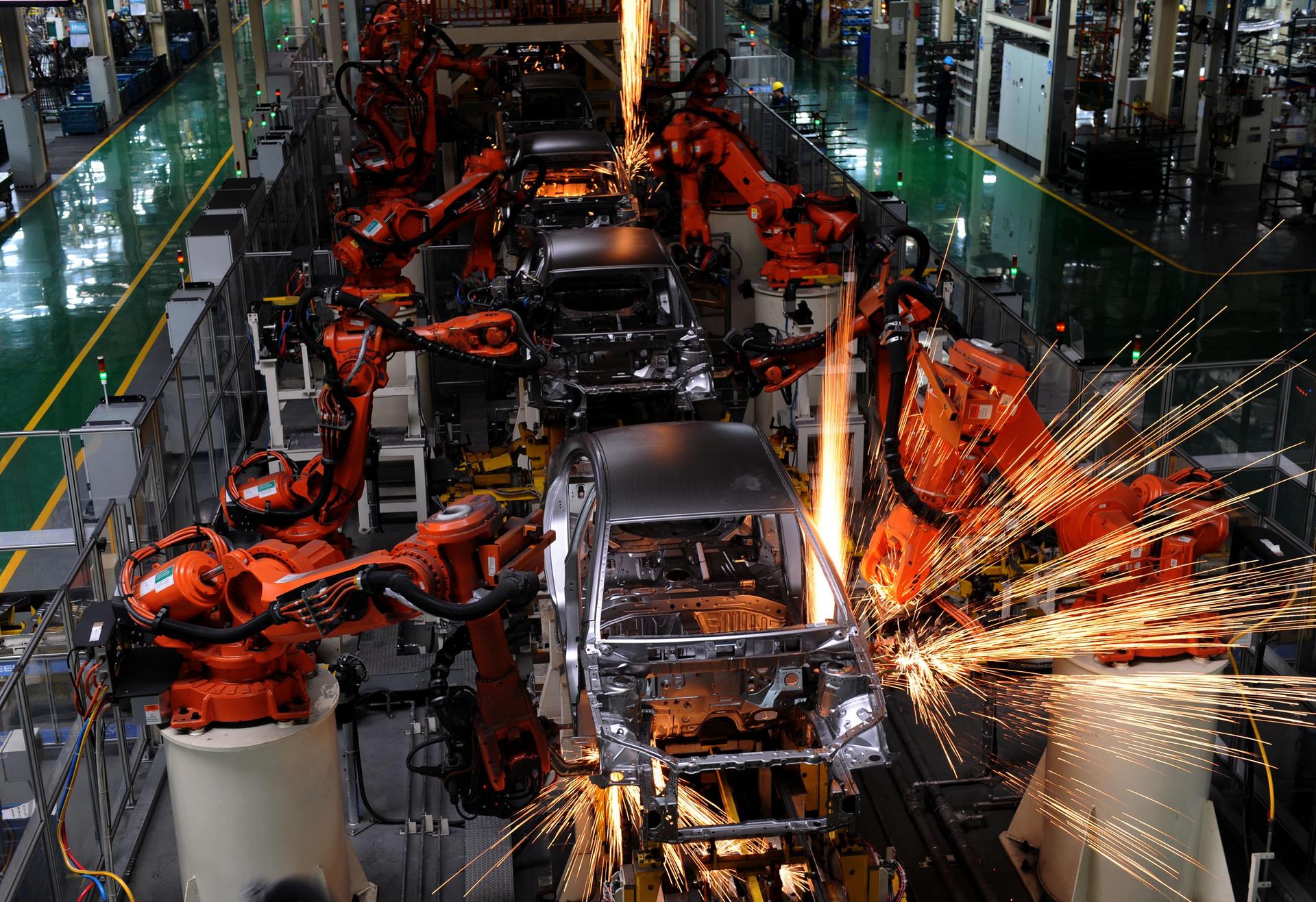 Robots in factories are making workers redundant. Photo: Xinhua